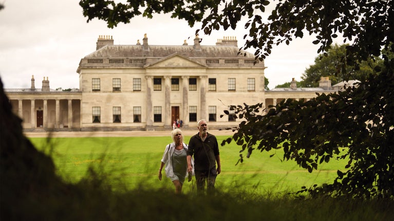 Visitors walking in the grounds of Castle Coole, County Fermanagh, Northern Ireland